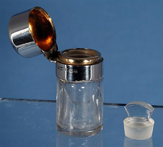 An Edwardian silver mounted glass scent bottle & a pair of scent bottles.